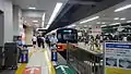 The manned QR code ticket readers at the southern end of platform 5 at Ikebukuro Station in September 2014