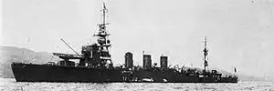 Black and white photograph of a World War II-era warship