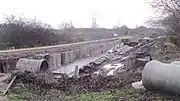 The Lichfield Canal in the process of restoration by Lichfield and Hatherton Canals Restoration Trust. This section runs along the A38, where the A51 crosses the route of the canal.