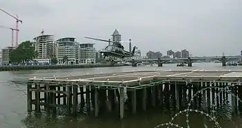 Image 25Helicopter landing at London Heliport, a jetty constructed in the River Thames in Battersea.