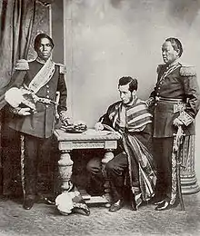 Image 28Malagasy Embassy to Europe in 1863. Left to right: Rainifiringa Ralaimaholy, Rev. John Duffus and Rasatranabo aka Rainandrianandraina. (from History of Madagascar)