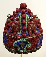 An example of a beaded royal coronet, (Akoro), Indianapolis Museum of Art. The Akoro was usually smaller than an Adé, fringeless and was usually worn by lesser ranking kings, nobles and community leaders under powerful regional Obas.