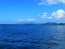 Image 26Monos (front) and Chacachacare (back). Venezuelan mainland (Paria Peninsula) seen in the horizon and Patos Island seen to the left. (from List of islands of Trinidad and Tobago)