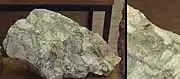 Toi ore with visible gold specks (30g of gold and 250g of silver per ton).
