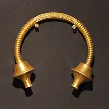 Torc from Burela, Galicia, with double moulding scotiae terminals, and hoop decoration.  At 1.812 kilos, the heaviest Iberian torc.